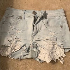 Hi rise distressed light washed ripped jean shorts